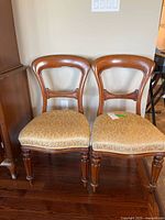 Full view of both Victorian-style chairs side by side