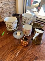 Group shot of planters, watering cans and roll for scale