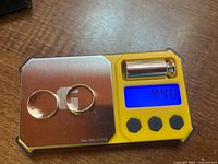 Both rings on scale showing total weight 4.40 g