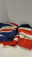 Two folded Union Jack flags showing color and material contrast
