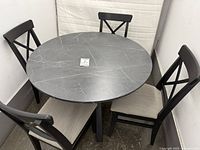 Full view of round table with four chairs