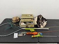 Overall lot showing tackle box, bag, net and rods