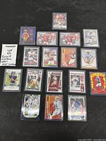 All 18 rookie cards laid out in protective sleeves