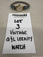 Full view of watch with note indicating lot