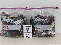 Two Hefty bags filled with Hot Wheels cars with label #2