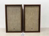 Front view of both Kenwood KL-60 speakers showing grille cloth and overall condition