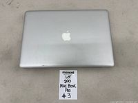 Closed top view showing Apple logo on silver lid