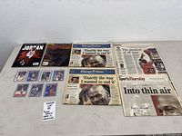 Full lot overview showing cards, book, magazine, newspapers