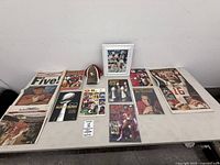 Overall layout of lot on table showing all memorabilia items