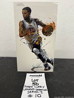 Front of boxed Stephen Curry figure showing illustration and product branding