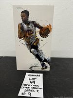 Front of boxed Steph Curry figure showing artwork and sealed package