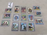 Overall shot of all 15 sleeved cards laid out flat