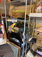 Full view of chrome wire shelving loaded with miscellaneous items