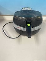 Front view of T-fal Actifry showing overall form and power cord