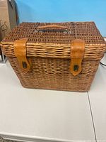 Closed wicker basket showing exterior and closures