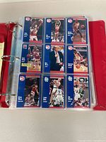 Page of nine Fleer Atlanta Hawks cards inside binder