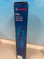 Front view of boxed Bosch BT150 tripod