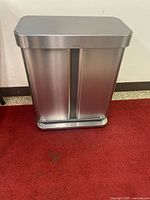 Full view of stainless steel dual-compartment trash can closed
