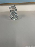 Front view of clear glass cat figurine