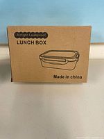 Cardboard box labeled “Airtight Leakproof Lunch Box”