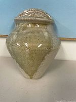 Front view of stoneware wall pocket vase