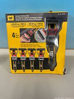 Front of CAT boxed ratchet tie-down set showing product and capacity