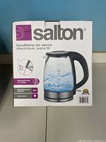 Retail box of Salton cordless glass electric kettle showing product image and specifications