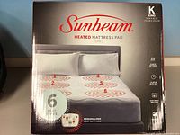 Retail box front showing Sunbeam heated mattress pad king size