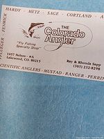 Business card from The Colorado Angler inside lot