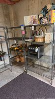 Both metal shelving units assembled and standing