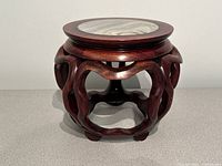 Full view of carved rosewood pedestal showing overall form and condition
