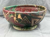 Side view showing multicolor glaze and geometric motifs