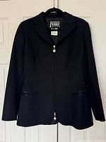 Front view of black jacket on hanger