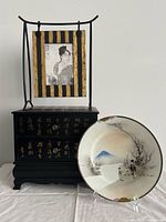 Group view of plate, jewelry chest and hanging frame