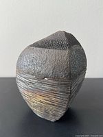 front view of textured Raku lidded container