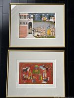 Both framed prints hung vertically showing overall design and frames