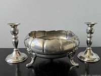 Entire set: footed bowl centered between two candlesticks