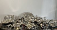 Full layout of silver-plated serving pieces