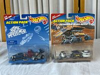 Both sealed Hot Wheels Action Pack sets front view