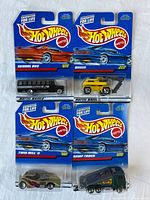 Front view of four Hot Wheels blister cards