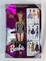 Front view of boxed Barbie doll and accessories
