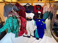 All 11 shirts laid out on two hanging rods