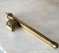 Full view of brass pen case showing length and attached inkwell