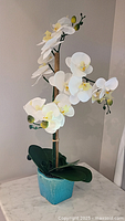 Full view of artificial orchid plant showing height and pot