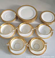 Full set laid out showing all plates, bowls and saucers
