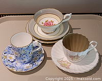Overview of three cup and saucer sets with extra side plate
