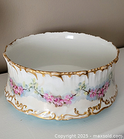 Overall view of Limoges cachepot showing scalloped rim and floral design