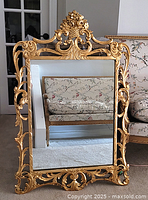 Full view of ornate gilt wood mirror front