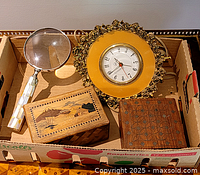 All items together in tray: magnifier, clock, two wooden boxes