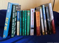 Full row of mystery novels showing spines and titles